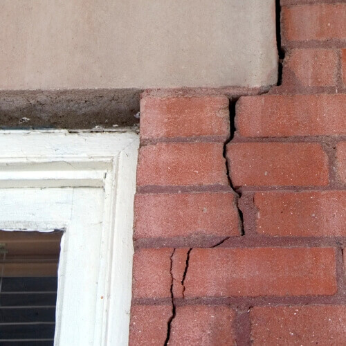 Cracked foundation around a window frame